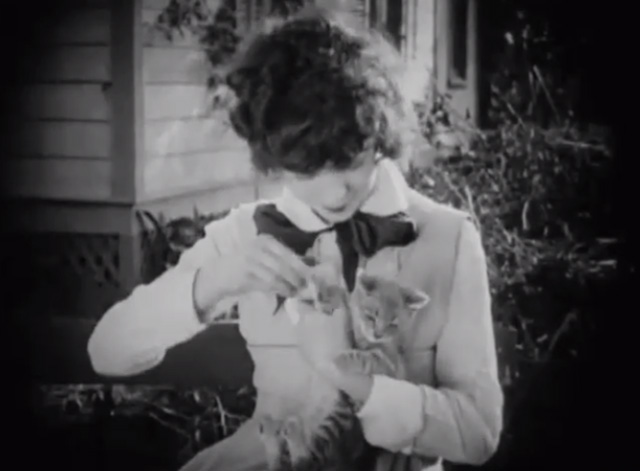 The Busher - Mazie Colleen Moore holding tabby kitten