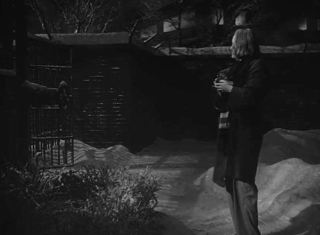 Caged - Marie Allen Eleanor Parker holding tiny tabby kitten Fluff outside prison