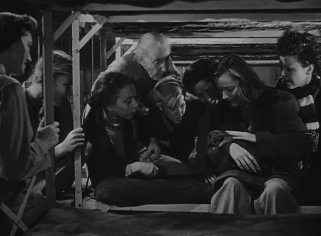 Caged - Marie Allen Eleanor Parker holding tiny tabby kitten Fluff on bunk surrounded by female inmates