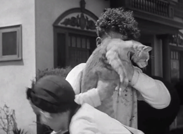 Call a Cop! - Mary Kornman handing tabby cat Genevieve to Mickey Daniels outside car