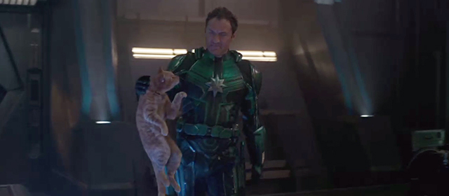Captain Marvel - ginger tabby cat Flerken Goose being held by scruff by Yon-Rogg Jude Law