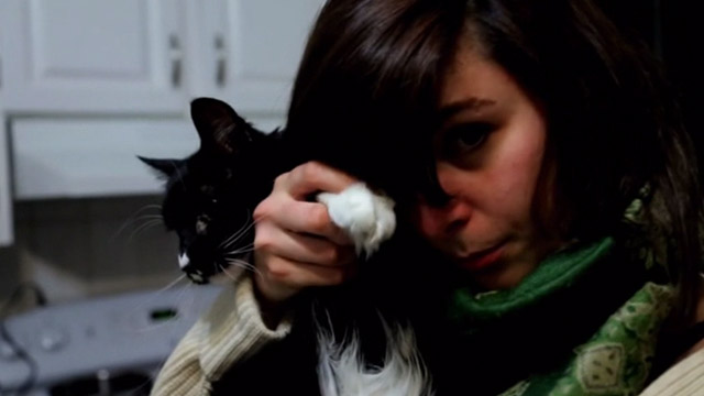 Capture Kill Release - Jennifer Fraser making tuxedo Norwegian Forest Cat Mittens Snorri wave at camera