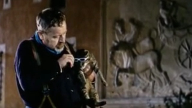 The Cassandra Cat - Oliva putting glasses on Mokol tabby cat