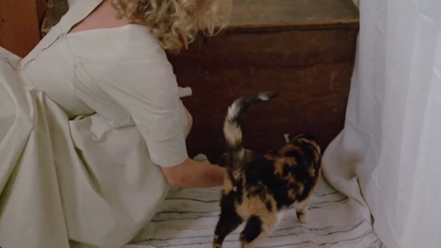 Catchfire - Anne Jodie Foster giving tortoiseshell cat Frida some milk in a bowl