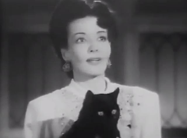 The Cat Creeps - Krya Iris Clive with black cat