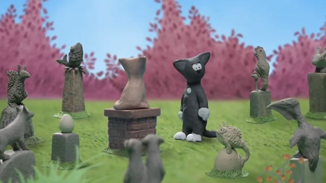 Cat in the Bag - clay black kitten with white paws in pet cemetary