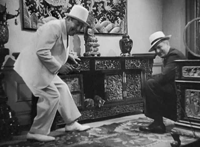 Charlie Chan in Shanghai - Charlie Chan Warner Oland and James Andrew Russell Hicks beside kittens in cabinet