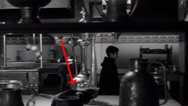 Children of the Damned - cat on table watching boy Rashid Mahdu Mathen