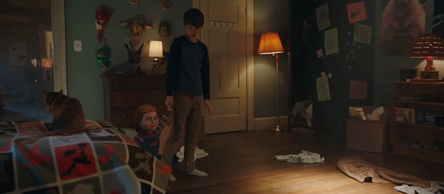 Child's Play - Andy Gabriel Bateman bringing Chucky doll into bedroom with ginger tabby cat Mickey Rooney on bed