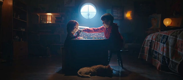 Child's Play - Andy Gabriel Bateman and Chucky doll playing game with ginger tabby cat Mickey Rooney beside table