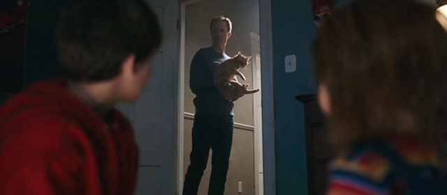 Child's Play - Andy Gabriel Bateman and Chucky doll with Shane David James Lewis in doorway holding ginger tabby cat Mickey Rooney