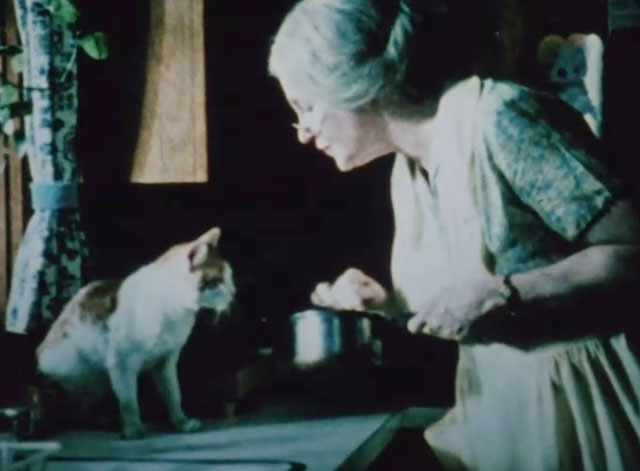 Chino's Tale - orange and white tabby cat Chino with Miss Mixter Geraldine Page holding pot