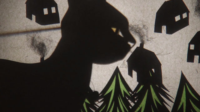 The Christmas Cat - shadow puppet large black cat in village
