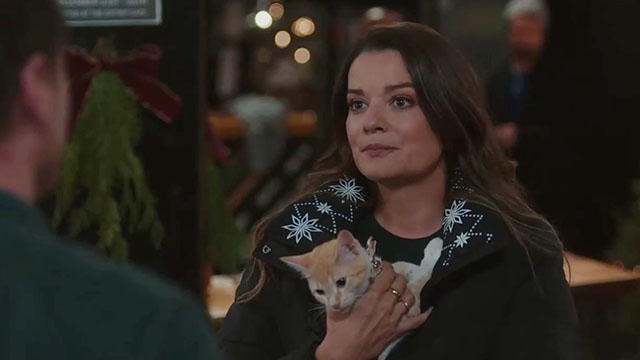 Christmas at the Catnip Cafe - Dr. Marilee White Kimberely Sustad holding ginger and white tabby kitten