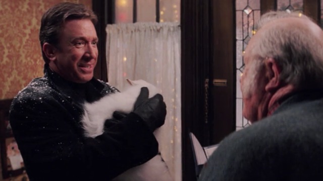 Christmas with the Kranks - Luther holding white Persian cat Muffles in arms