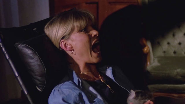 City of the Living Dead - Paura nella città dei morti viventi - Sandra Janet Agren screaming while holding fluffy grey tabby kitten