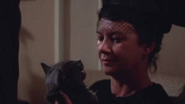 Class of '44 - woman holding gray cat