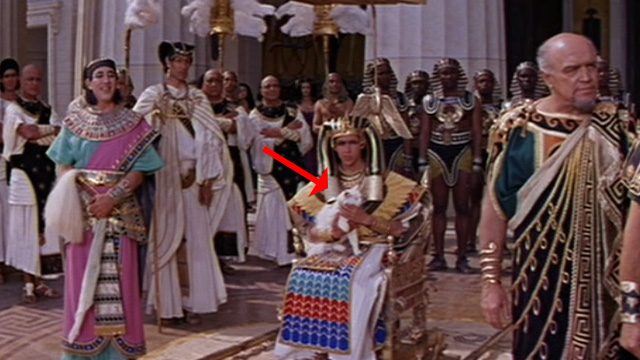 Cleopatra - Ptolemy Richard O'Sullivan holding white long haired cat with Pothinus Gregoire Aslan