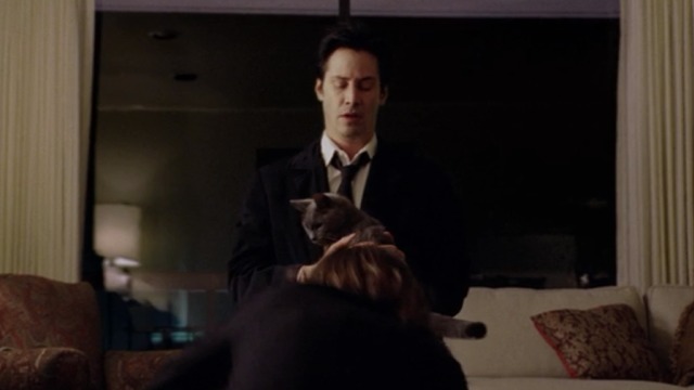 Constantine - Constantine Keanu Reeves sitting with Russian Blue cat Duck on lap