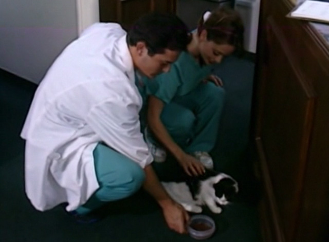 The Corpse Grinders 2 - Nurse Angie Cara Jo Basso feeding tuxedo cat Kitty with Dr. Glass Paul MacDonald