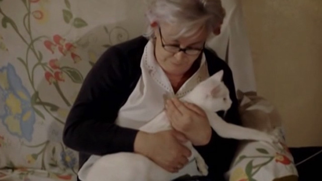 The Corpse Grinders 2 - Arnie's mother holding white cat Mr. Beasley the Second