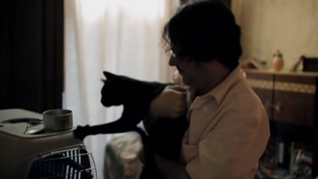 The Corpse Grinders 2 - Arnie Pedro García Oliva feeding black cat