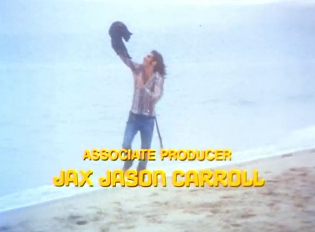 The Cremators - hippie Mason Caulfield running on beach with black cat