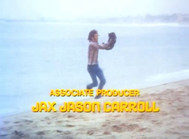 The Cremators - hippie Mason Caulfield running on beach with black cat