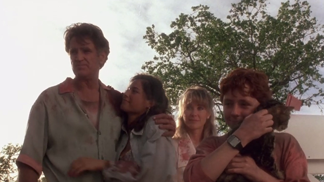 Critters - Brad Scott Grimes holding Bengal tabby cat Chewie with Brown family gathered around Billy Green Bush Dee Wallace Stone and Nadine Van Der Velde