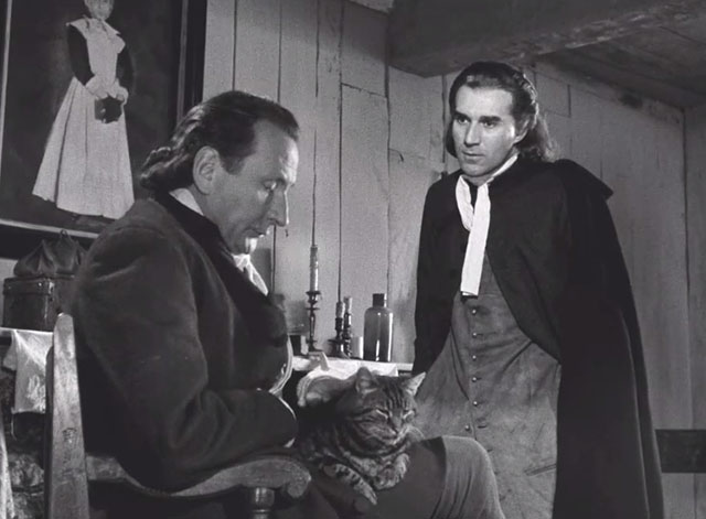 The Crucible - Thomas Alfred Adam petting tabby cat in lap with James Michel Piccoli