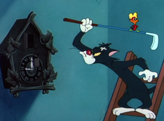 The Cuckoo Clock - black and white cat with cuckoo sitting on golf club