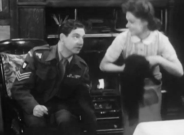 The Cure for Love - Jack Robert Donat with Milly Renee Asherson picking up black cat