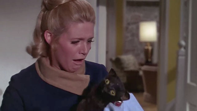 Daddy's Gone A-Hunting - fake black cat Prissy picked up by shocked Cathy Carol White