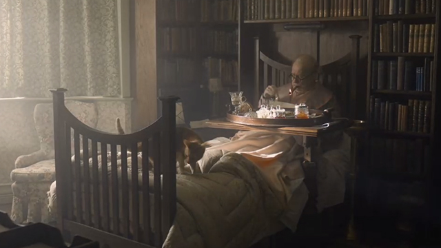 Darkest Hour - ginger tabby cat on end of Churchill Gary Oldman bed