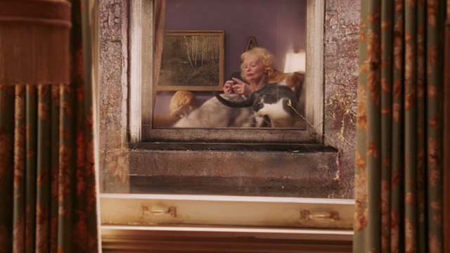 Date Movie - cat lady Beverly Polcyn with cats as seen through window
