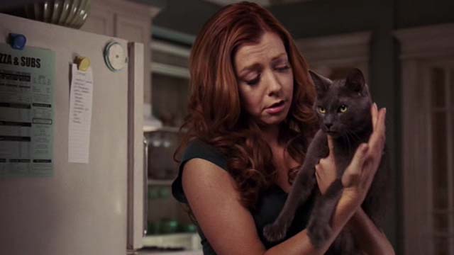 Date Movie - Julia Alyson Hannigan holding gray cat