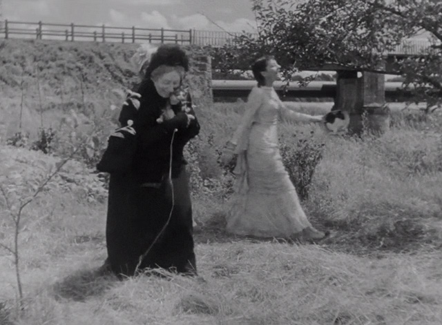 A Day in the Country - grandmother Gabrielle Fontan walking and hugging tabby kitten