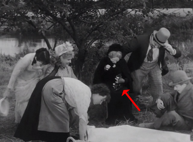 A Day in the Country - grandmother Gabrielle Fontan sitting and holding tabby kitten at picnic