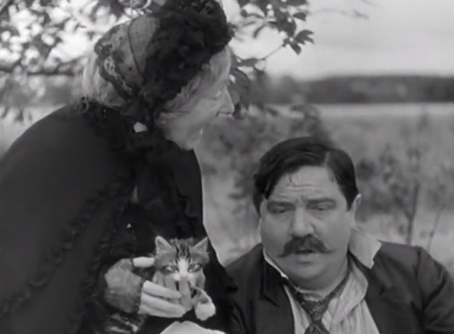 A Day in the Country - grandmother Gabrielle Fontan sitting and holding tabby kitten at picnic