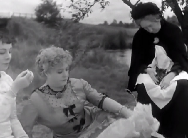A Day in the Country - grandmother Gabrielle Fontan sleeping and holding tabby kitten at picnic behind Madame Dufour Jane Marken