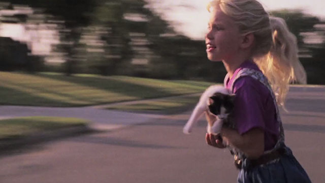 Dead Before Dawn - Kathleen Kimberly Horner running across street holding tuxedo kitten