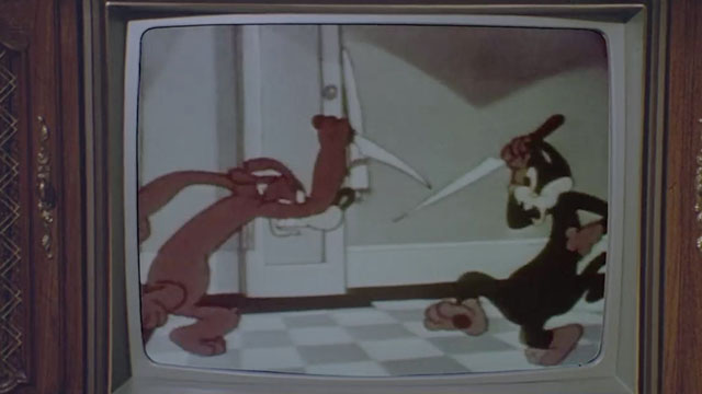Dead Before Dawn - scene from cartoon Cheese Burglar with dog and cat in knife fight on television