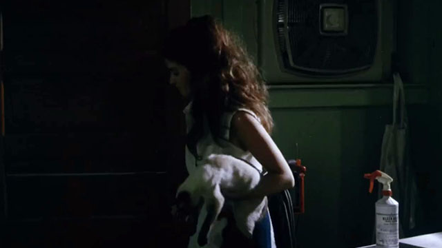 Death Screams - Ramona Jennifer Chase holding Siamese cat inside restaurant