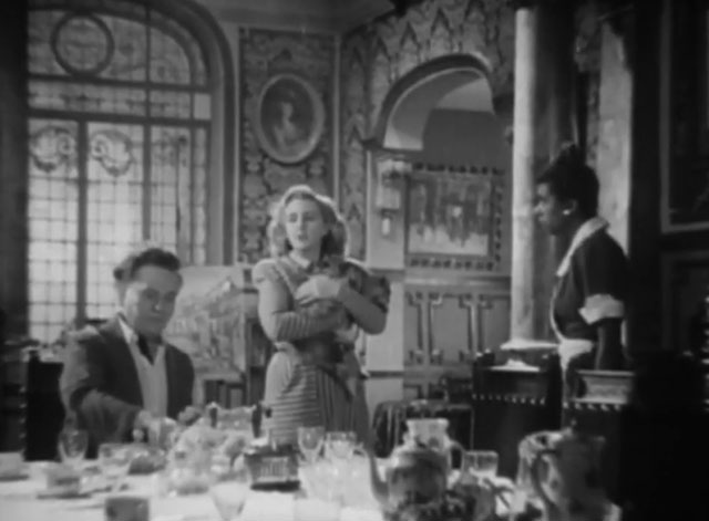 Death Walks in the Rain - La muerte camina en la lluvia - longhair tabby cat held by Valeria Duval Margarita Corona