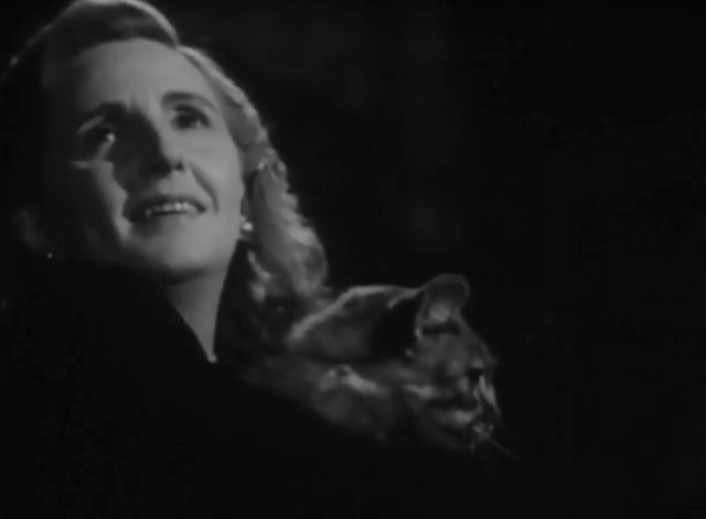 Death Walks in the Rain - La muerte camina en la lluvia - longhair tabby cat hugged by Valeria Duval Margarita Corona