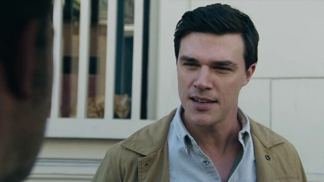 Deep Water - ginger tabby cat in window behind Tony Finn Wittrock