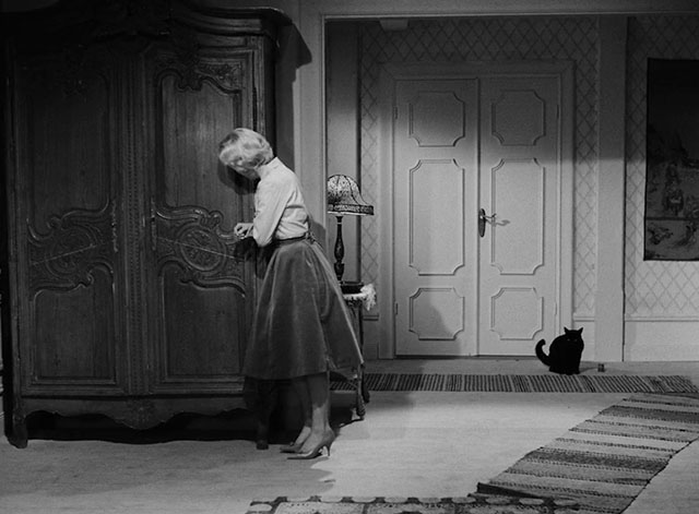 The Devil's Eye - Djävulens öga - black cat sitting by doorway with Britt-Marie Bibi Anderson