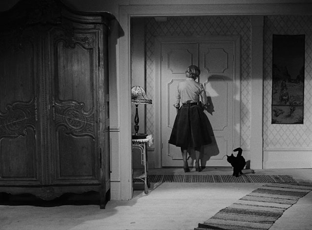 The Devil's Eye - Djävulens öga - black cat sitting by doorway with Britt-Marie Bibi Anderson