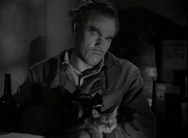 Dick Tracy's Dilemma - The Claw pets cat in lap