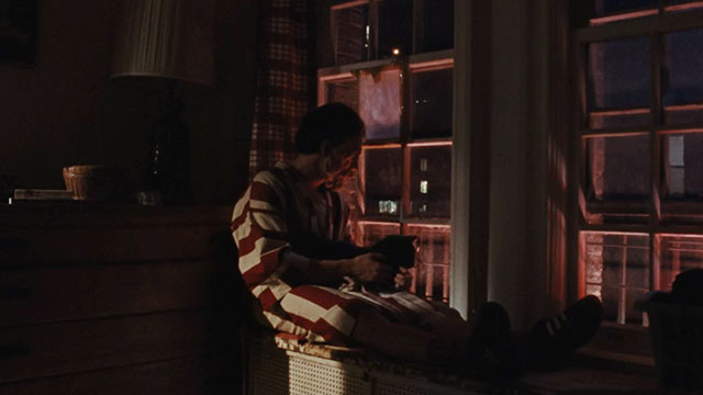 A Different Man - blue cat sitting on Edward Sebastian Stan lap at window